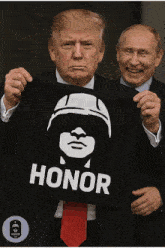 a man in a suit and tie holds up a black banner that says honor
