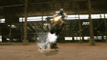 a person riding a motorcycle with sparks coming out of the wheels