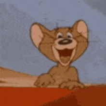 jerry from tom and jerry is laughing and pointing at something .