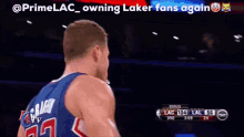 a basketball player with the words " owning laker fans again " written above him