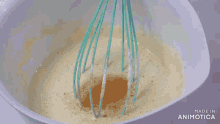 a person is mixing ingredients in a bowl with a whisk and the words ground on the bottom