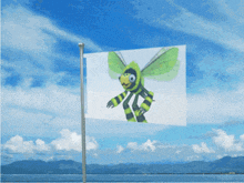 a flag with a picture of a bee on it is flying in the wind