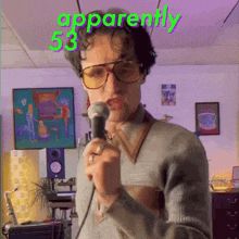 a man singing into a microphone with the words apparently 53 on the top