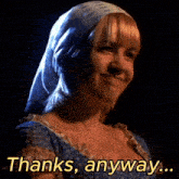 a woman wearing a head scarf is smiling with the words thanks anyway behind her
