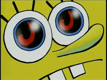 a close up of spongebob 's eyes with a red j on them