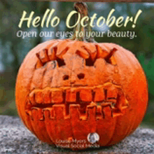 a carved pumpkin with the words hello october open our eyes to your beauty on it