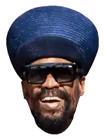 a man wearing a blue hat and sunglasses smiles