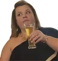 a woman is holding a glass of beer in her hand