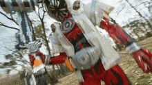 a person in a red and white costume with a sword