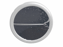 a button with a glowing face in the middle of it