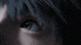 a close up of a person 's eye with a blue background