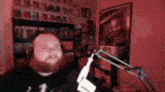 a man with a beard is singing into a microphone .