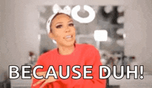 a woman is wearing a red sweater and a headband and says `` because duh ! ''