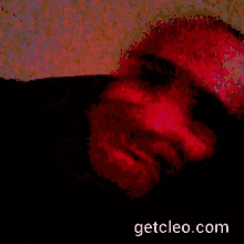 a pixelated image of a man 's face with the website getcleo.com in the corner