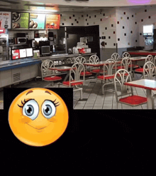 a cartoon smiley face is displayed in front of a restaurant