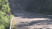 a car is driving down a road with a sign that says 40 on it