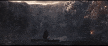 an aerial view of a very large body of water with smoke coming out of it