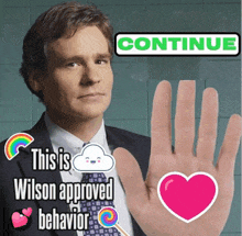 a man in a suit and tie is holding up his hand with the words this is wilson approved behavior