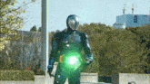 a man in a superhero costume with a green light
