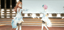 two anime girls are dancing on a stage and one has a pink hair color