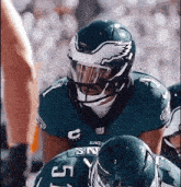 a close up of a football player wearing a helmet