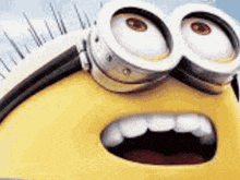 a close up of a minion 's face with a surprised look on his face .