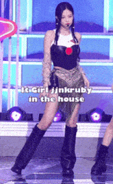a woman stands on a stage with the words " it girl jinkruby in the house " on the bottom