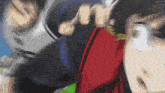 a blurry image of a person 's face with a red jacket on