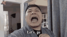 a man with his mouth open and the words let 's go written below him