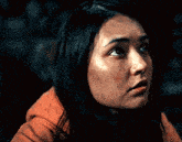 a close up of a woman 's face with a smile on her face .
