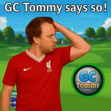 a man wearing a red liverpool shirt is scratching his head