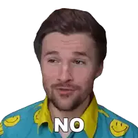 a man with a beard wearing a blue shirt with smiley faces on it says no