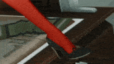 a woman wearing red stockings and black shoes is standing on a desk