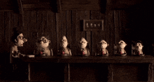a group of cartoon characters sitting at a table