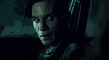 a close up of a man 's face with a serious look on his face