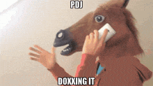 a man wearing a horse mask talking on a cell phone