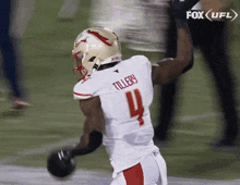 a football player with the number 4 on the back of his jersey