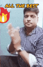 a man in a striped shirt is making a gesture with the words all the best above him