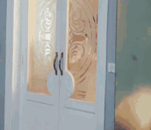 a woman in a white dress is standing in front of a door
