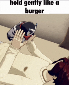 a person laying on a bed holding a bird with the words hold gently like a burger below them