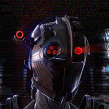 a close up of a robot 's face with glowing red eyes
