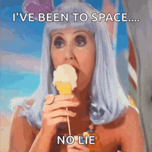 a woman eating an ice cream cone with the caption i 've been to space