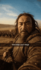 a man with a beard is taking a selfie and the caption says next stop your village