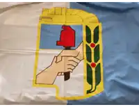 a flag with a hand holding a hammer and a wheat leaf