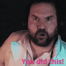 a man with a beard and headphones says " you did this "
