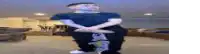a blurry picture of a man sitting on a chair .