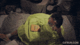 a woman in a green dress is laying on a bed with a book on her lap that says mcdonald 's