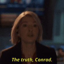 a woman says " the truth conrad " in yellow letters