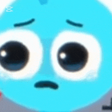 a close up of a cartoon character 's face with big eyes .