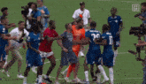 a group of soccer players are standing on a field and one has the number 29 on his shirt